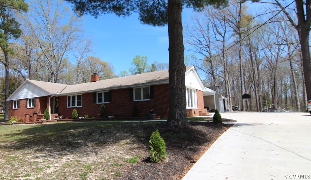 12801 Harrowgate Road Chester, VA 23831 - Photo 6 of 21 a front view of a house with a yard