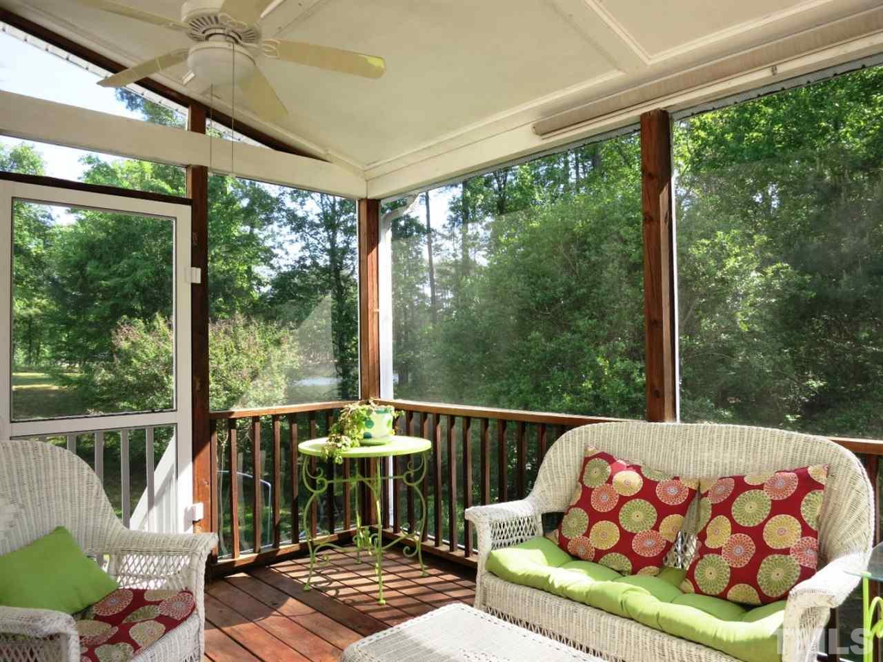 4908 Fly Way Drive Raleigh, NC 27604 - Photo 21 of 25 The Screened Porch w/2 CFs is off the Bfast area and accesses the grilling Deck.