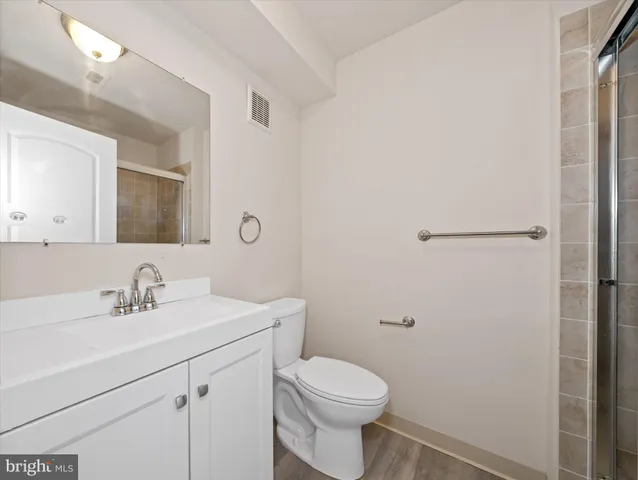 a bathroom with a sink toilet and vanity