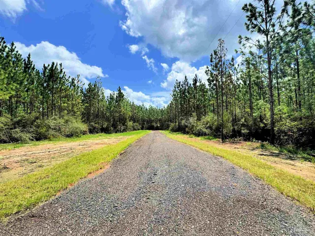 a view of a swimming pool with an outdoor space and seating area