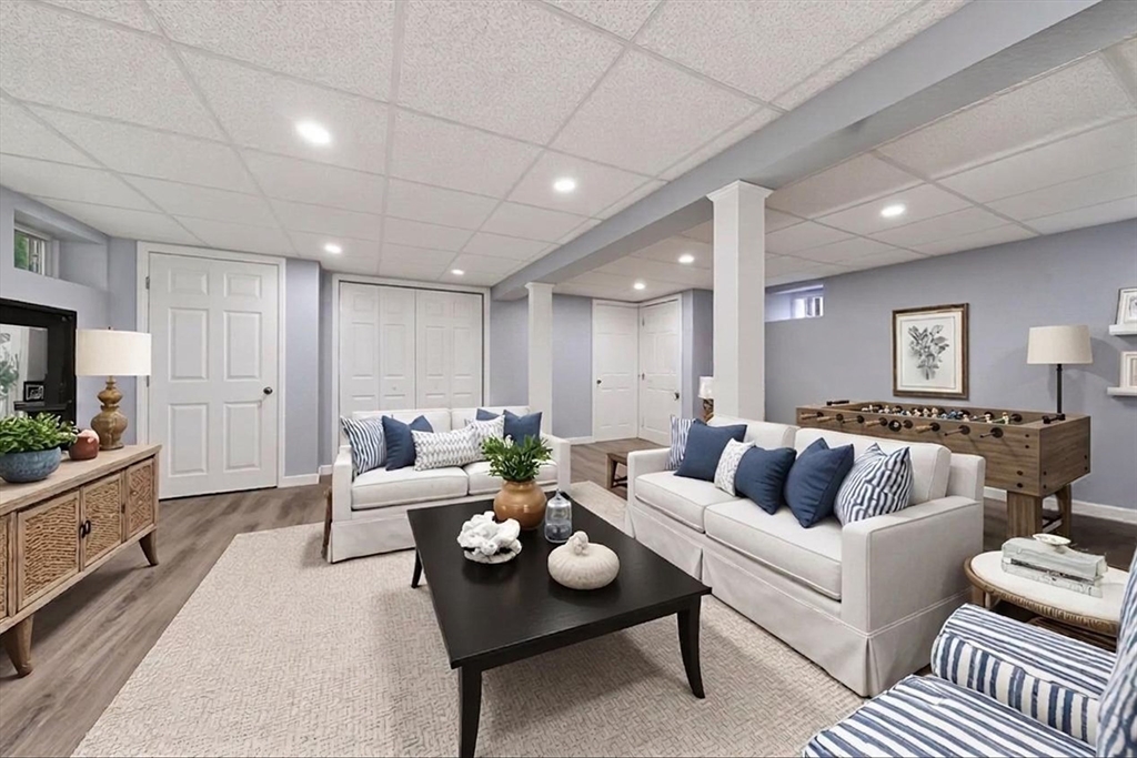 59 First Parish Road Norwell, MA 02061 - Photo 25 of 37 a living room with furniture and a flat screen tv