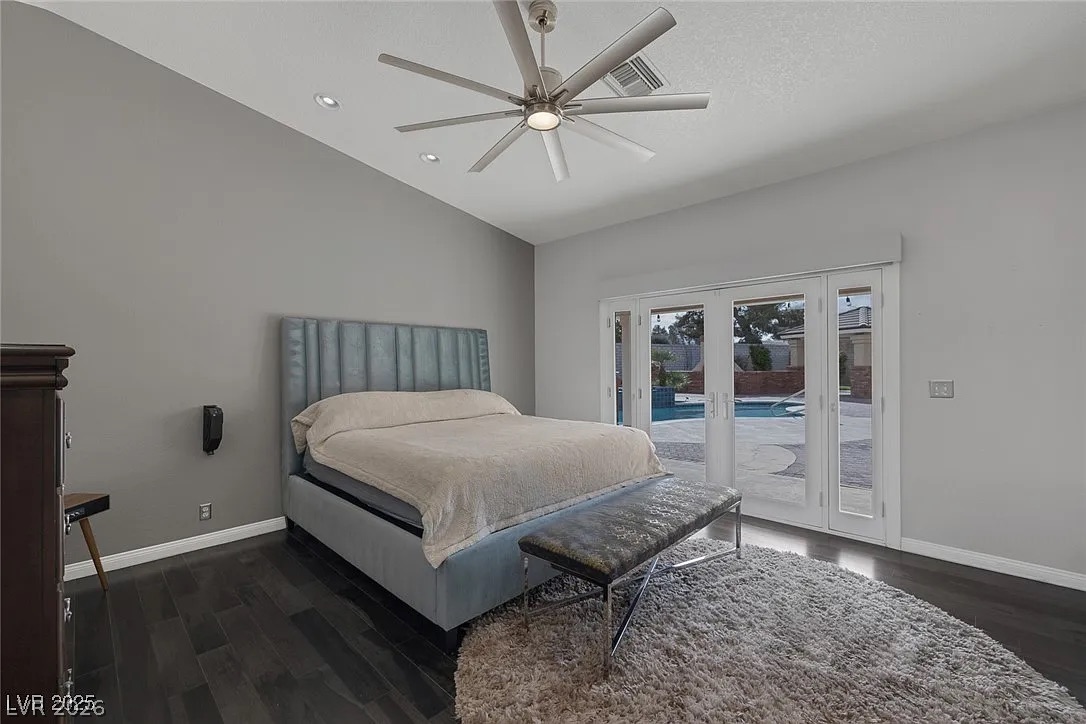 9 Quail Run Road Henderson, NV 89014 - Photo 23 of 57 French doors open to a refreshing pool view from this relaxing bedroom oasis.