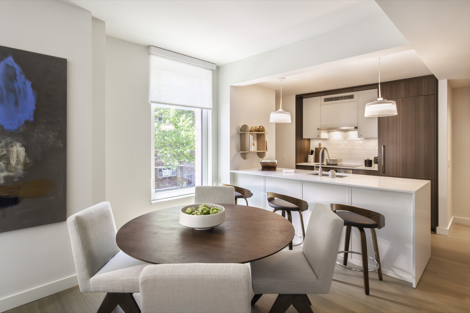 a view of a dining room with furniture and window