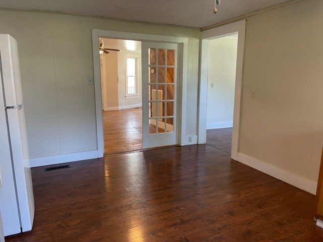 301 Bennett Street Decherd, TN 37324 - Photo 15 of 41 an empty room with wooden floor and windows