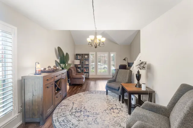 a view of a livingroom with furniture window and wooden floor