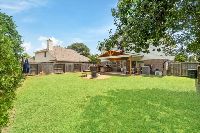 a front view of a house with a garden and porch