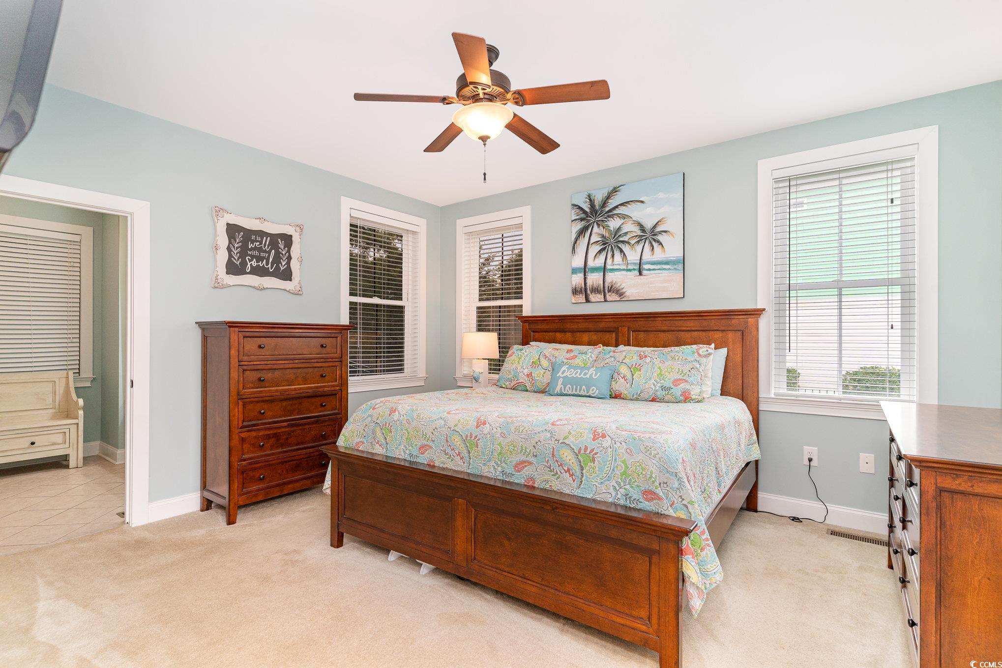 116 Lake Pointe Drive Murrells Inlet, SC 29576 - Photo 16 of 36 Bedroom featuring ceiling fan and light colored ca