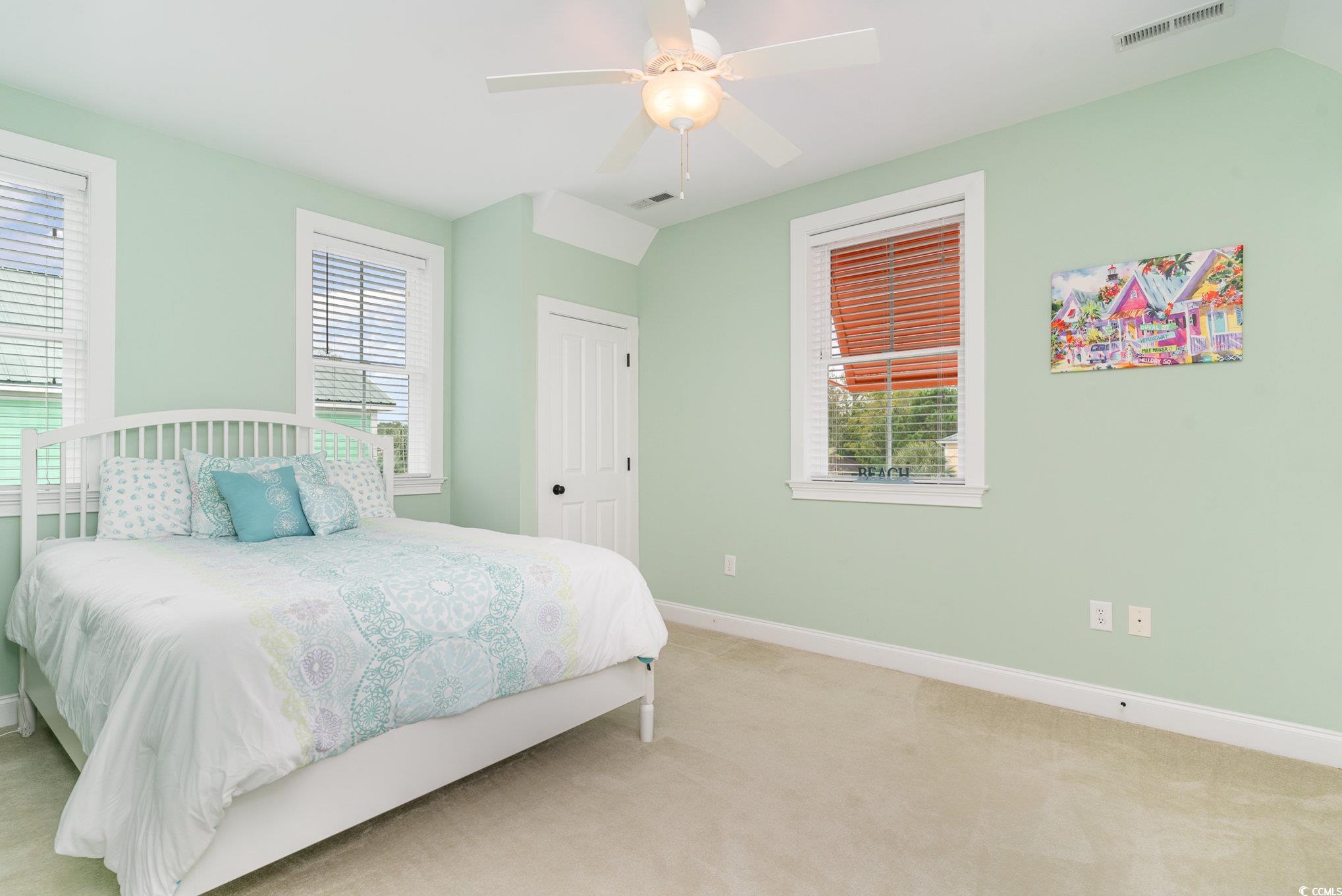 116 Lake Pointe Drive Murrells Inlet, SC 29576 - Photo 25 of 36 Bedroom with ceiling fan, light colored carpet, an