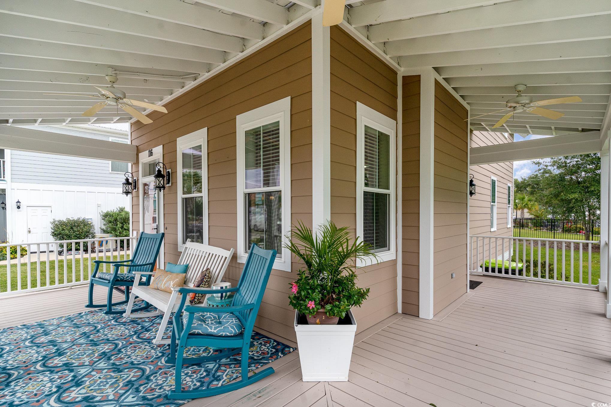 116 Lake Pointe Drive Murrells Inlet, SC 29576 - Photo 5 of 36 Wooden terrace with ceiling fan and covered porch