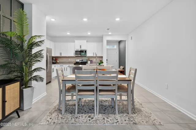 a kitchen with sink a stove and cabinets