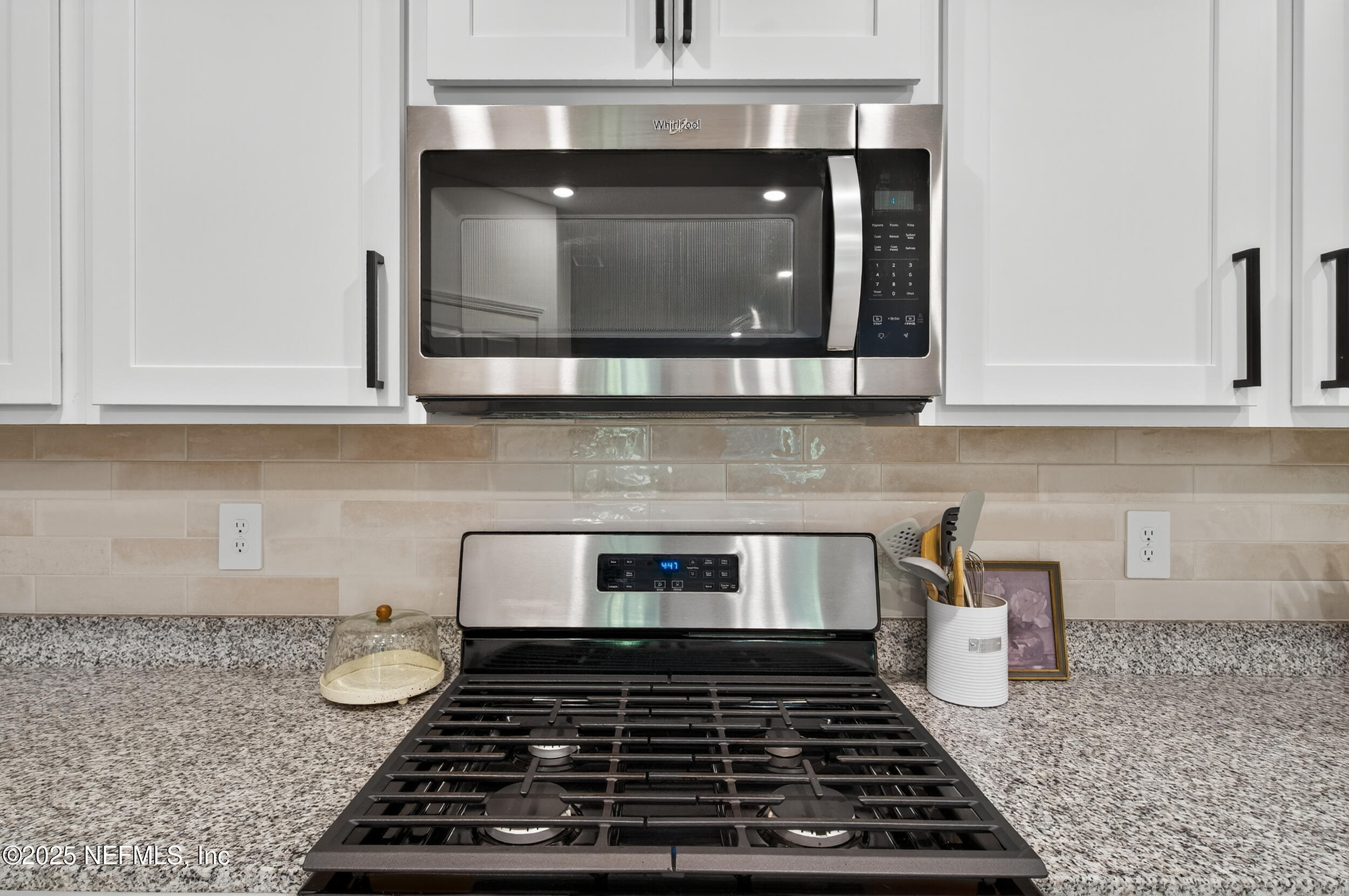 33 Coastline Way St. Augustine, FL 32092 - Photo 16 of 35 a kitchen with a stove and cabinets