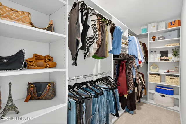 a large white bed in a white room