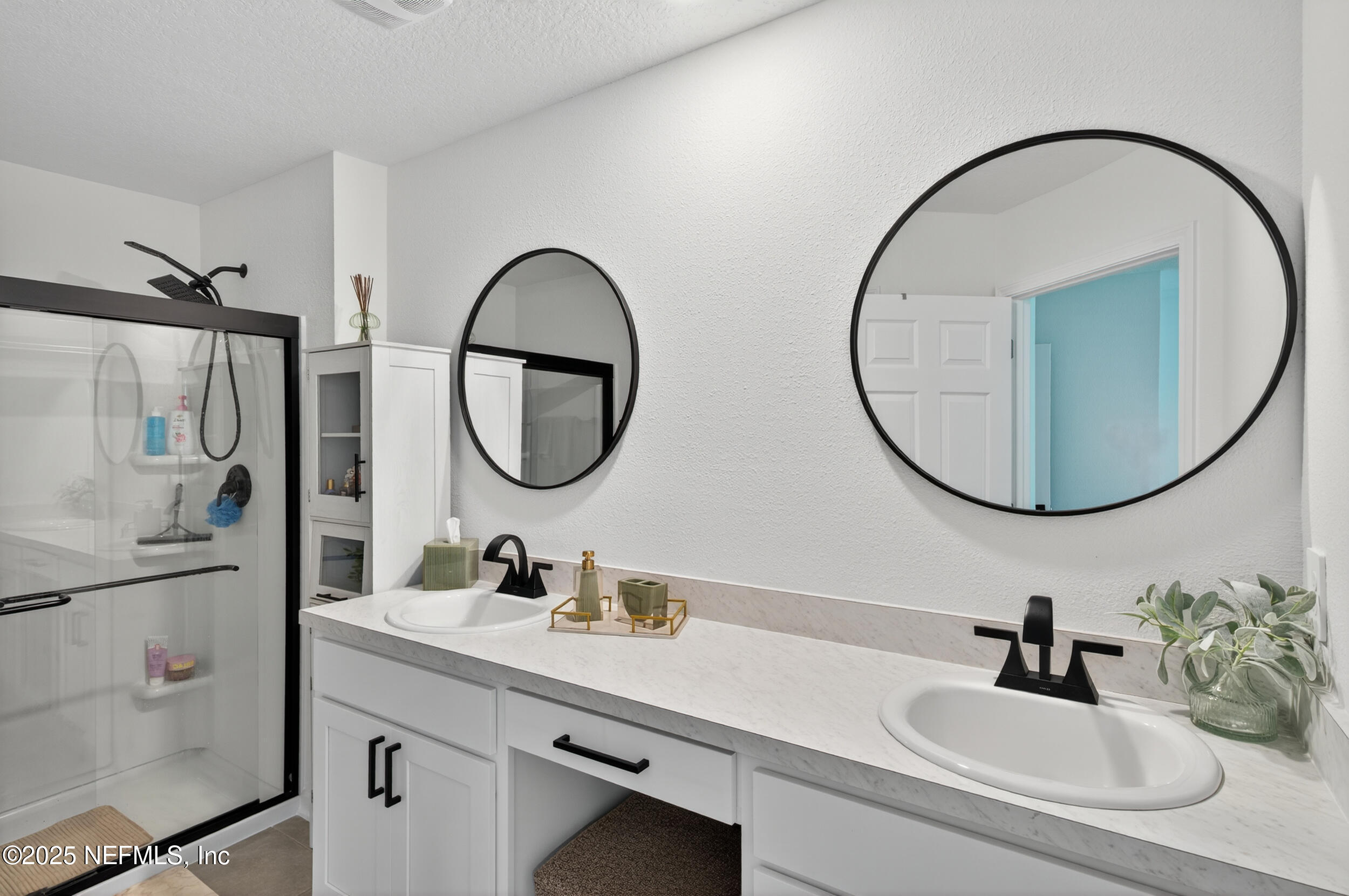 33 Coastline Way St. Augustine, FL 32092 - Photo 23 of 35 a bathroom with a sink a mirror a vanity and a mirror