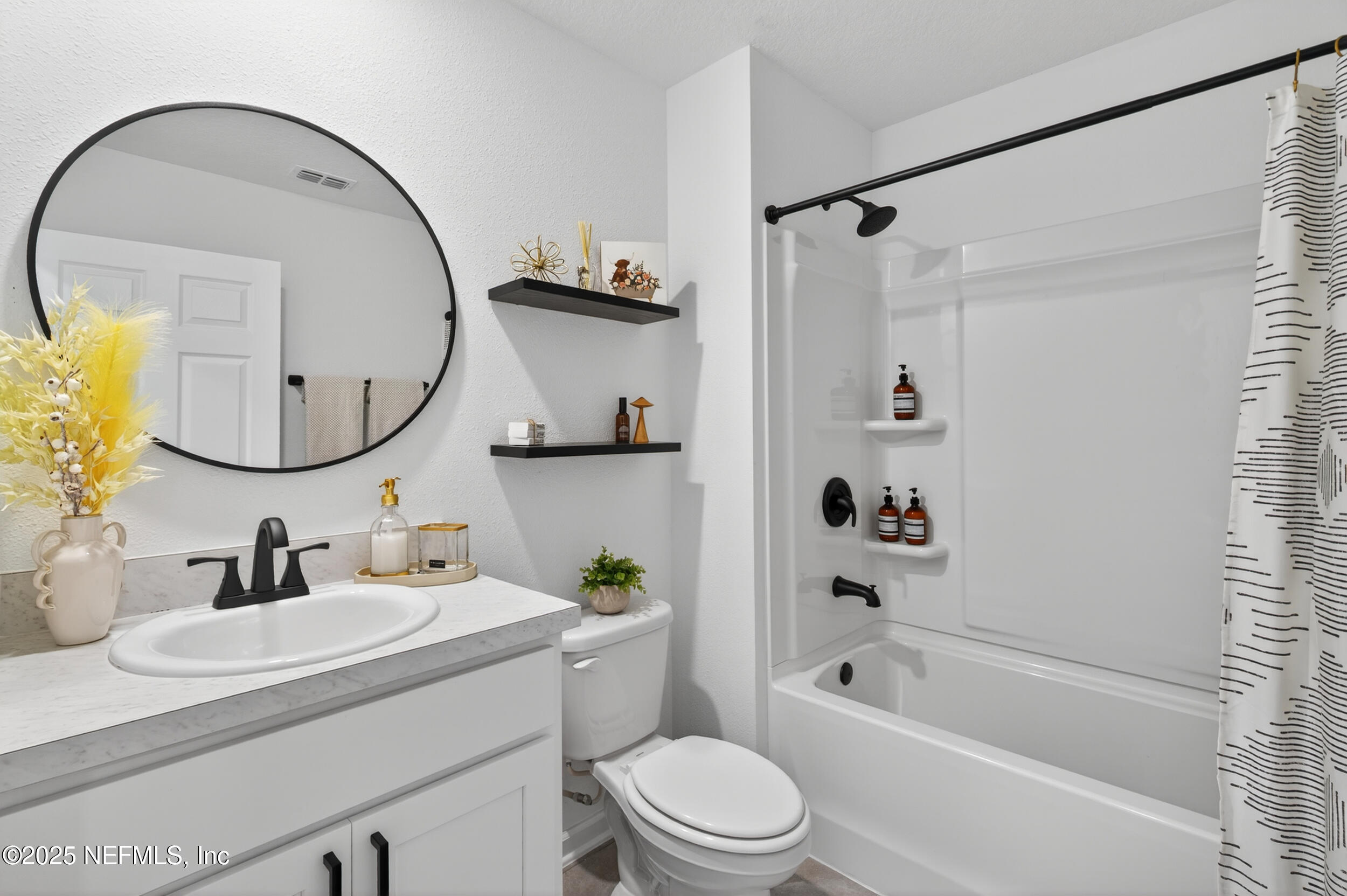 33 Coastline Way St. Augustine, FL 32092 - Photo 29 of 35 a bathroom with a sink a mirror a toilet and a bathtub