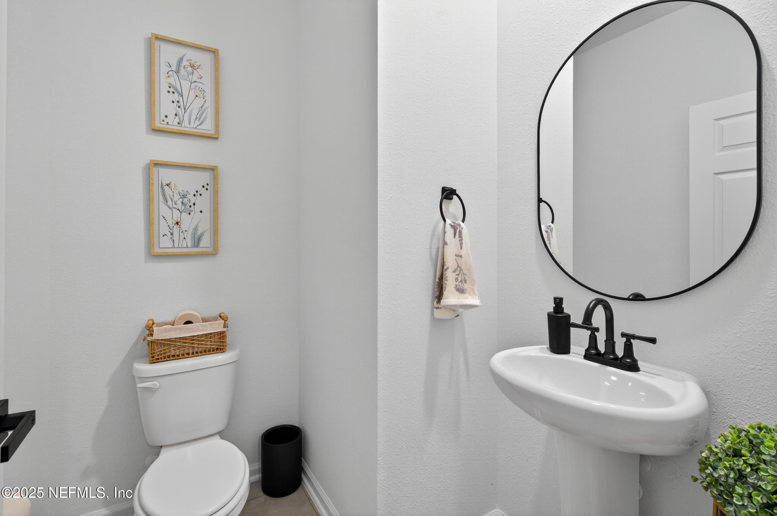 33 Coastline Way St. Augustine, FL 32092 - Photo 30 of 35 a bathroom with a toilet a sink and mirror