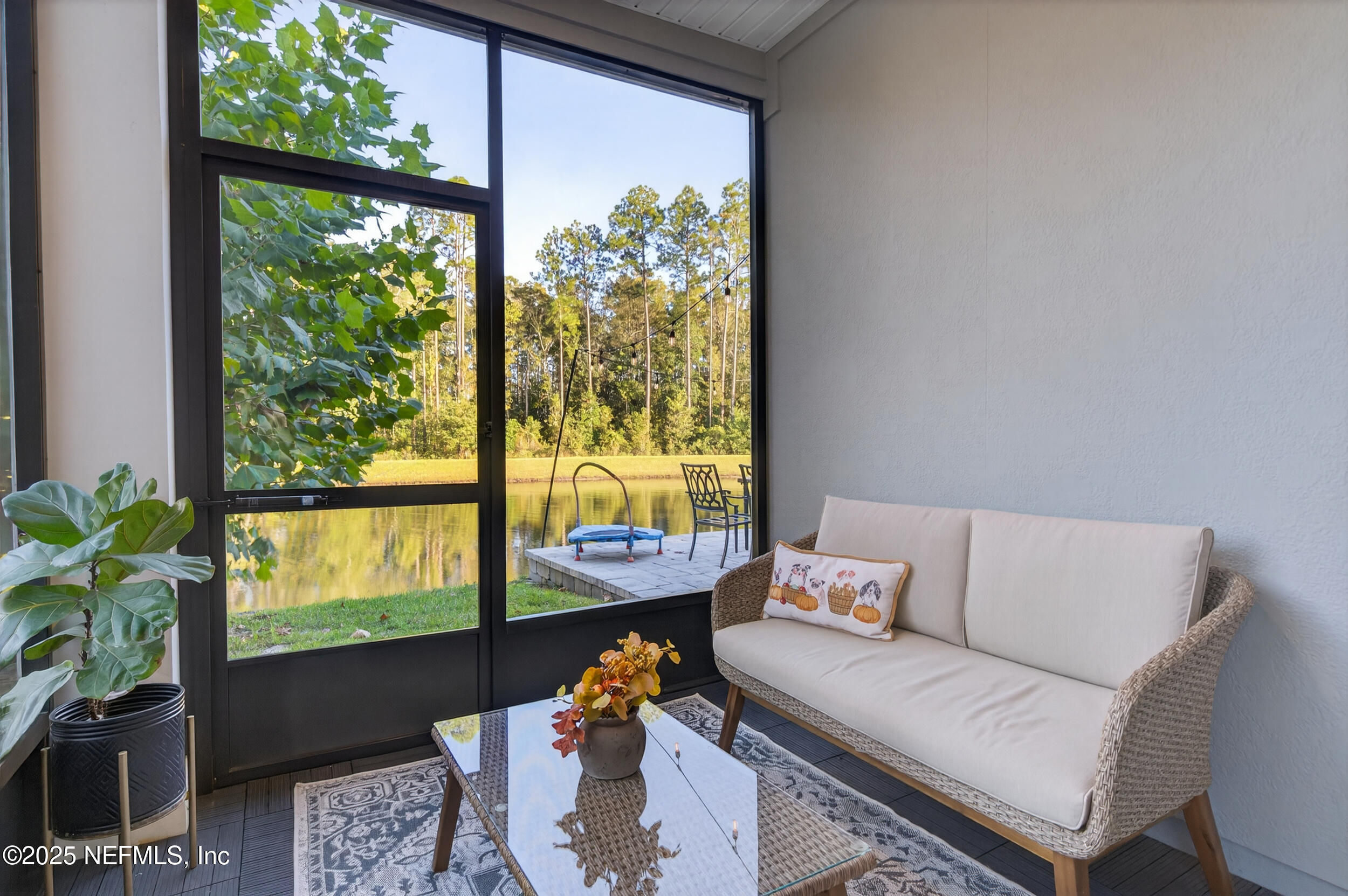 33 Coastline Way St. Augustine, FL 32092 - Photo 32 of 35 a living room with furniture and a flat screen tv