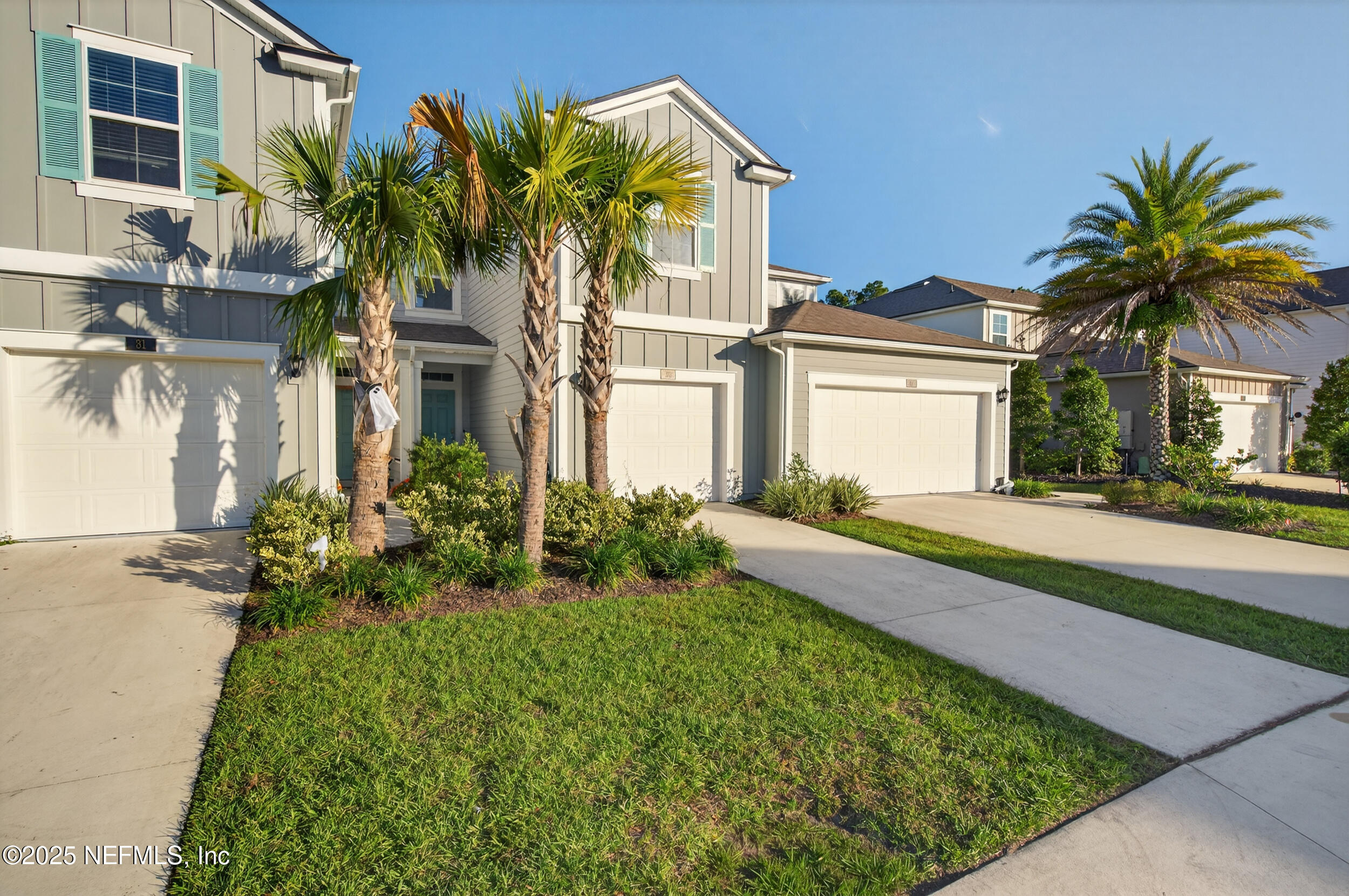 33 Coastline Way St. Augustine, FL 32092 - Photo 4 of 35 a front view of a house with a garden and yard