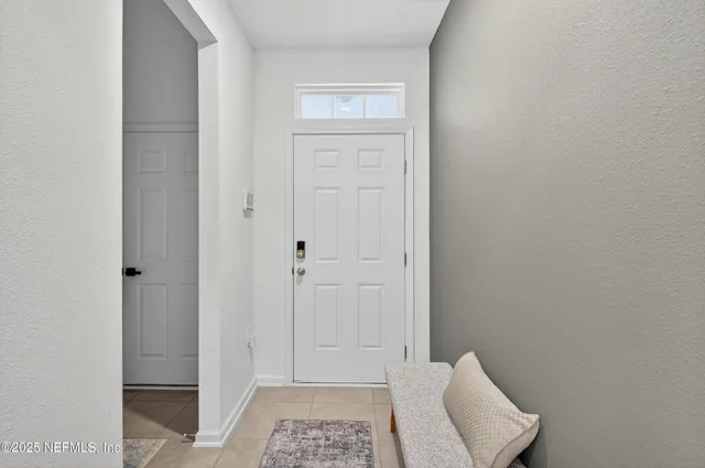 a kitchen with stainless steel appliances granite countertop a sink a stove and refrigerator