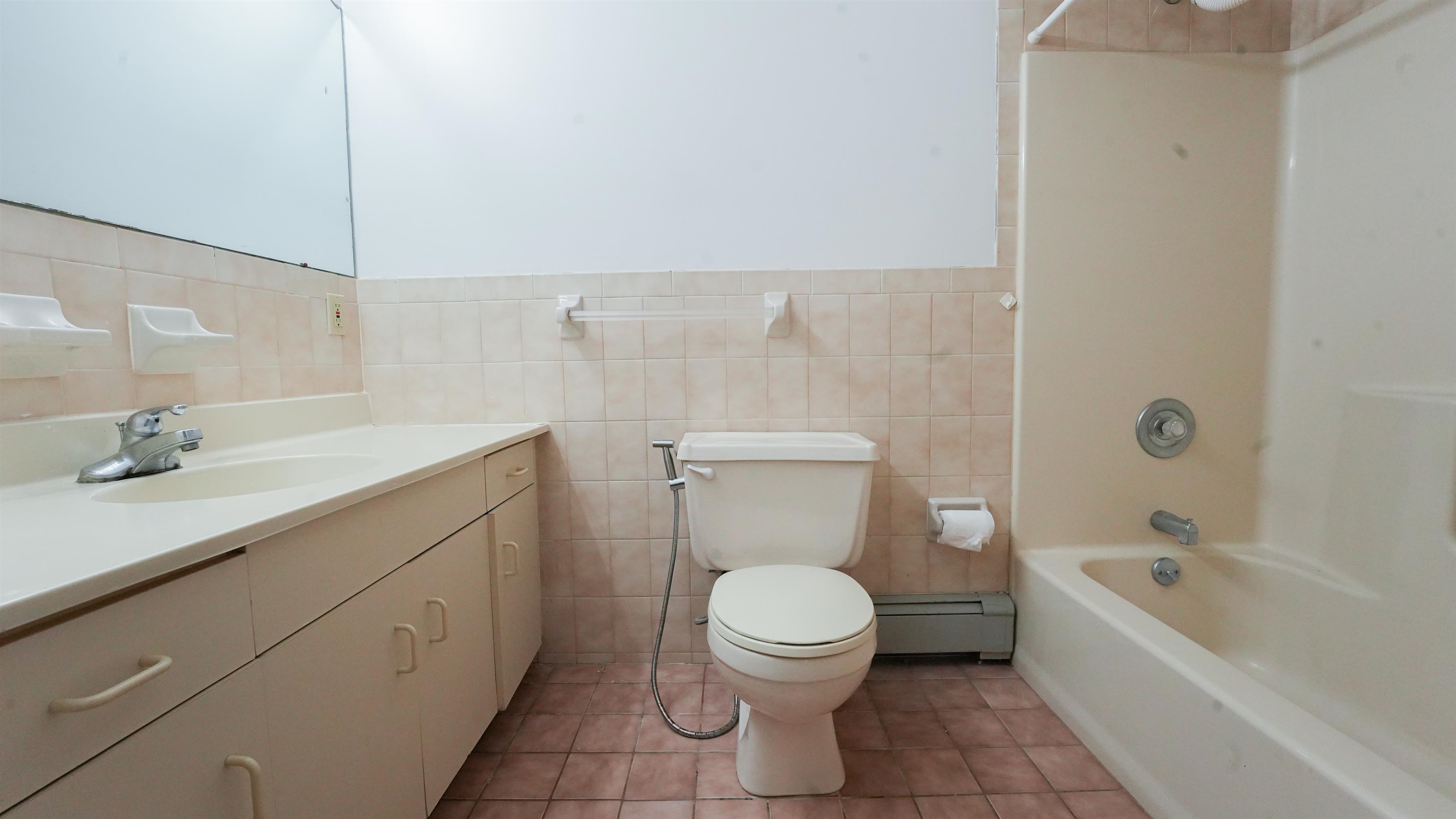 24 Riverview Court, Unit 24 Secaucus, NJ 07094 - Photo 18 of 25 a bathroom with a sink a toilet and bathtub