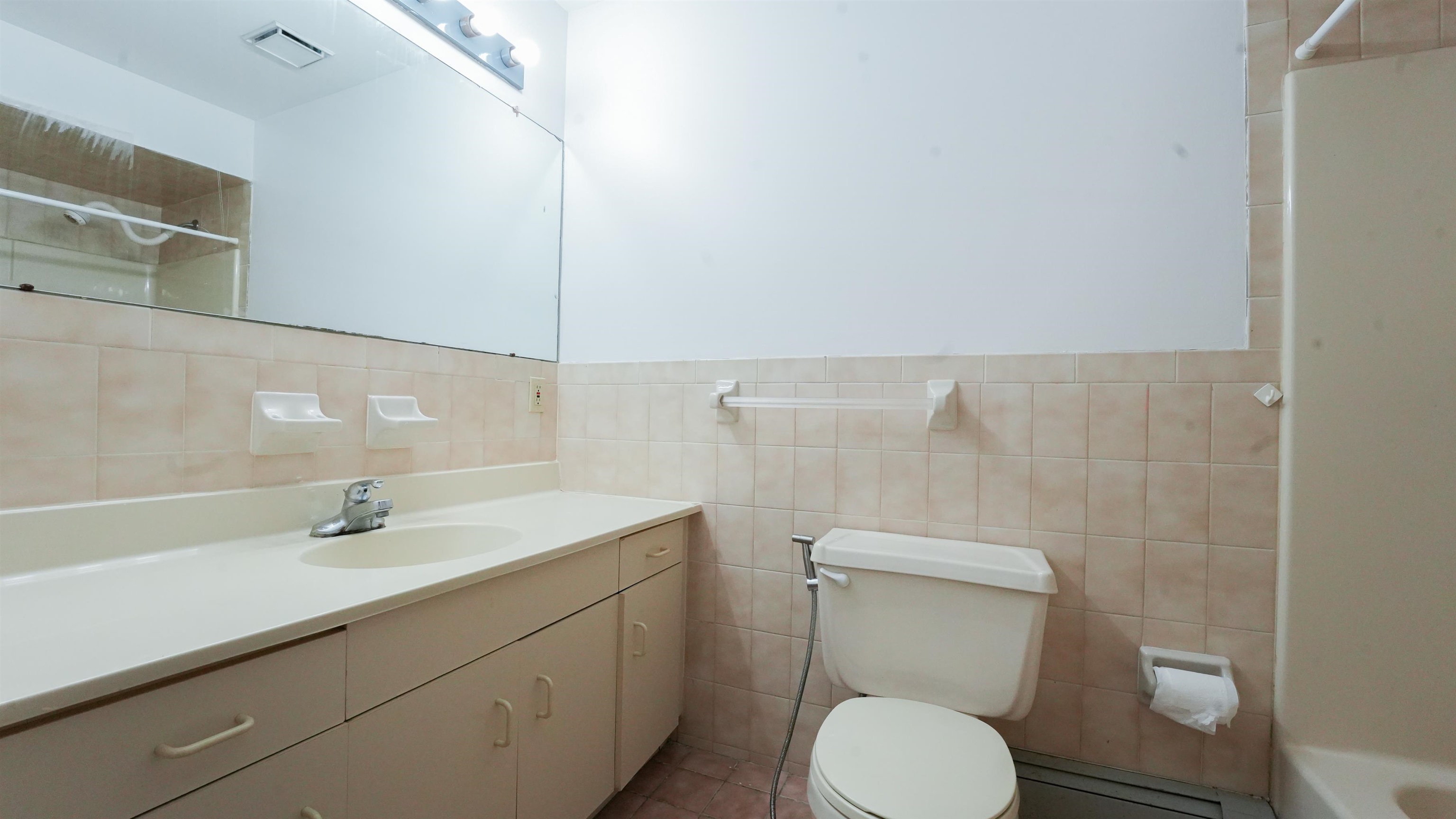 24 Riverview Court, Unit 24 Secaucus, NJ 07094 - Photo 19 of 25 a bathroom with a sink toilet and vanity