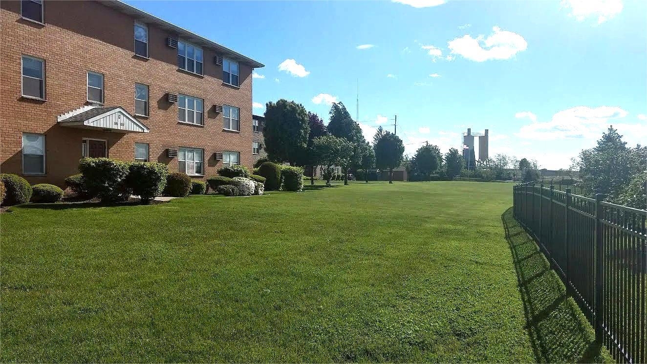 24 Riverview Court, Unit 24 Secaucus, NJ 07094 - Photo 24 of 25 a view of a building in front of a big yard