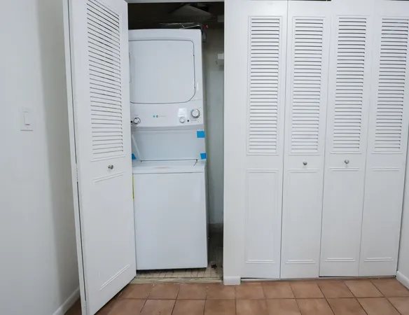 a kitchen with a refrigerator a sink and a stove