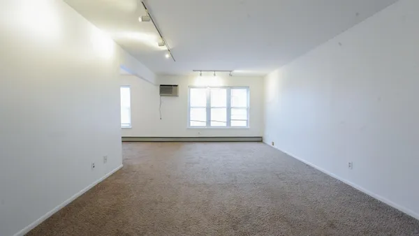 an empty room with windows