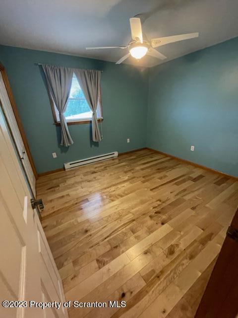 108 Baker Hirkey Road Tunkhannock, PA 18657 - Photo 33 of 66 a view of a room with a ceiling fan and hardwood floor