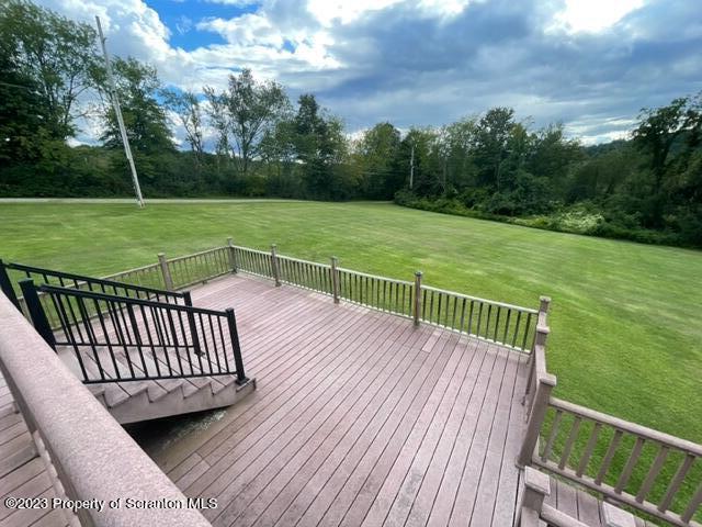 108 Baker Hirkey Road Tunkhannock, PA 18657 - Photo 57 of 66 a view of a deck with a yard