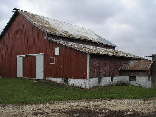6198 Beede Road Carroll County, IL 61014 - Photo 4 of 6 a front view of a house with a garden