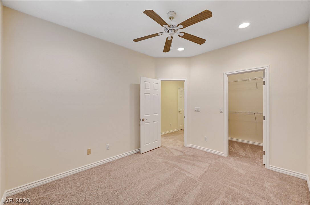 6761 Clay TABLET Street Las Vegas, NV 89149 - Photo 64 of 73 Recessed lighting and soft carpeting create a comfortable atmosphere in this bedroom with walk-in closet.