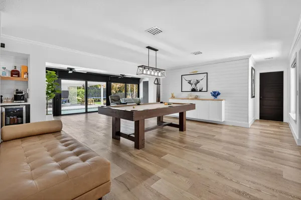 a bedroom with furniture and flat screen tv
