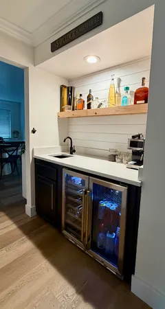 a view of a house with swimming pool and sitting area