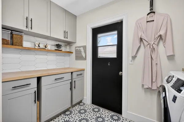 an aerial view of residential houses with outdoor space and swimming pool