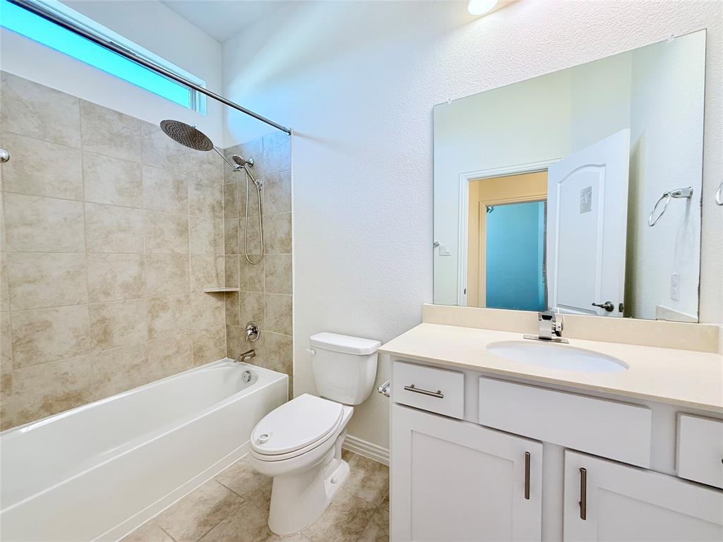1336 Morning View Road Georgetown, TX 78628 - Photo 8 of 40 A well-appointed bathroom with a spacious vanity and a bathtub/shower combination.