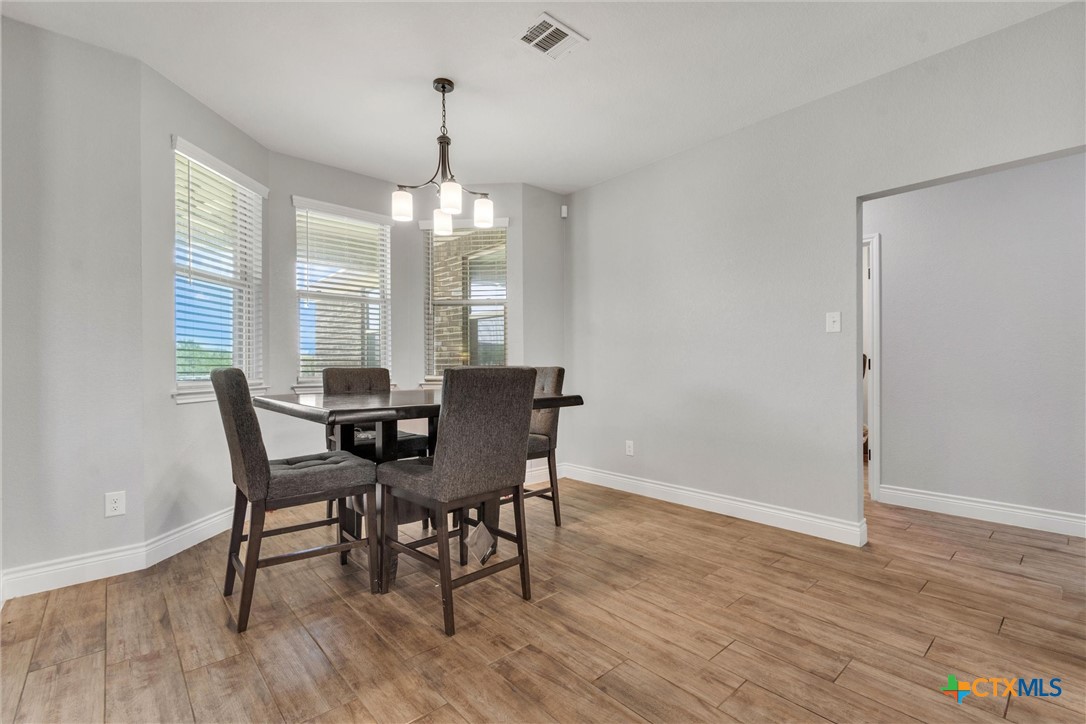 3919 Gracey Lane Kempner, TX 76539 - Photo 22 of 44 a view of a dining room with furniture window and wooden floor