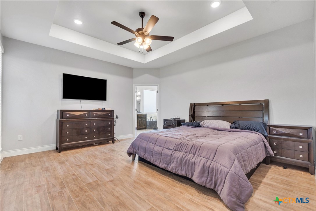 3919 Gracey Lane Kempner, TX 76539 - Photo 33 of 44 a bedroom with a bed and a flat screen tv