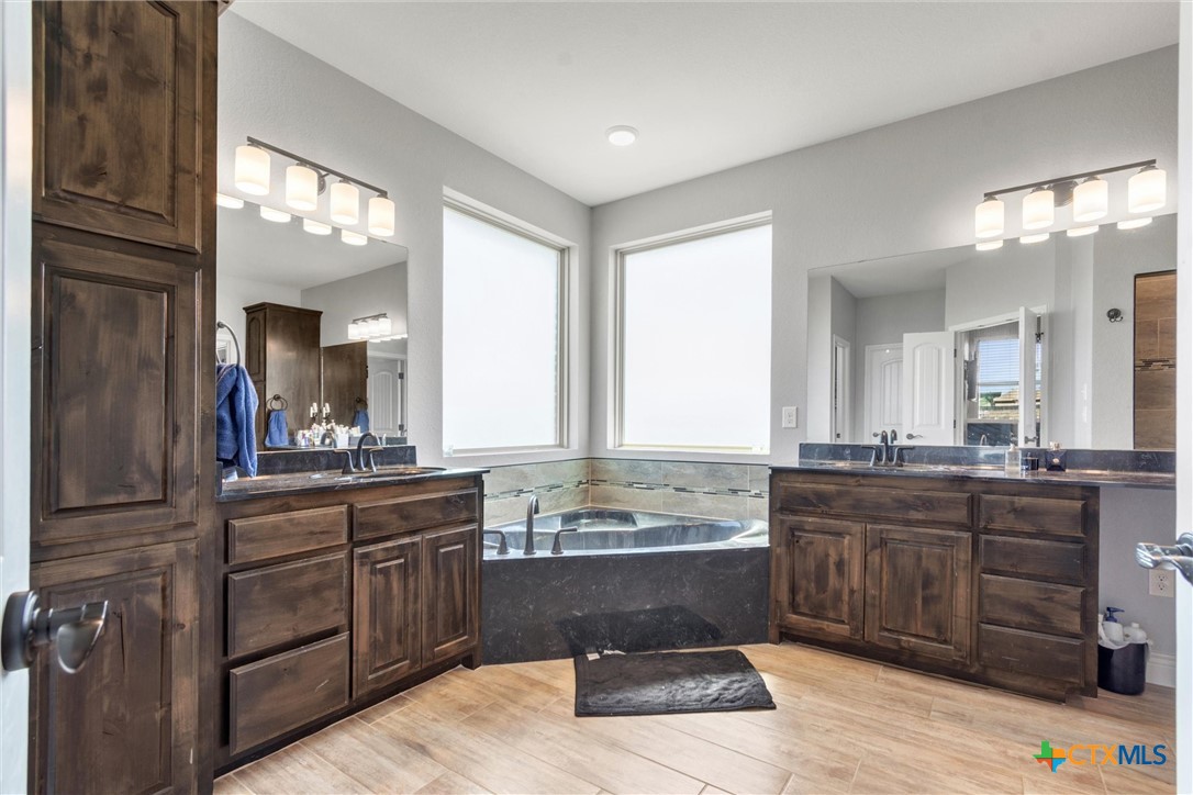 3919 Gracey Lane Kempner, TX 76539 - Photo 35 of 44 a large bathroom with double vanity and a large mirror or sink