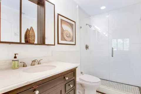 a living room with furniture dining table and a chandelier