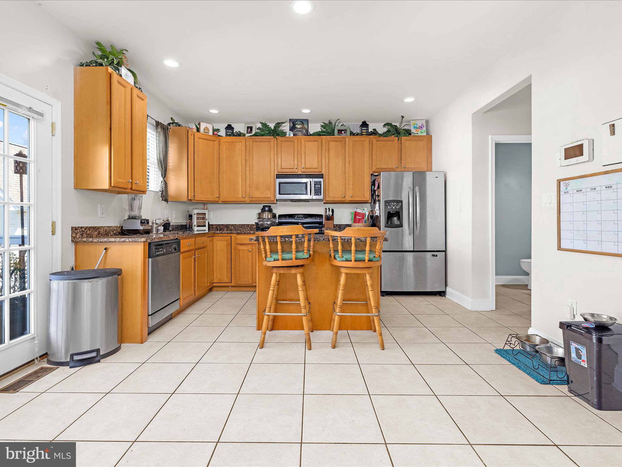 166 Meadow Road Pasadena, MD 21122 - Photo 11 of 47 a kitchen with stainless steel appliances granite countertop a stove top oven a sink dishwasher and a refrigerator