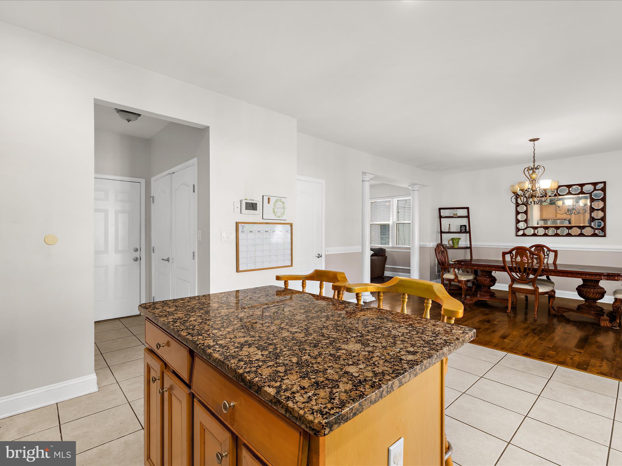 166 Meadow Road Pasadena, MD 21122 - Photo 13 of 47 a living room with dining table and a couch