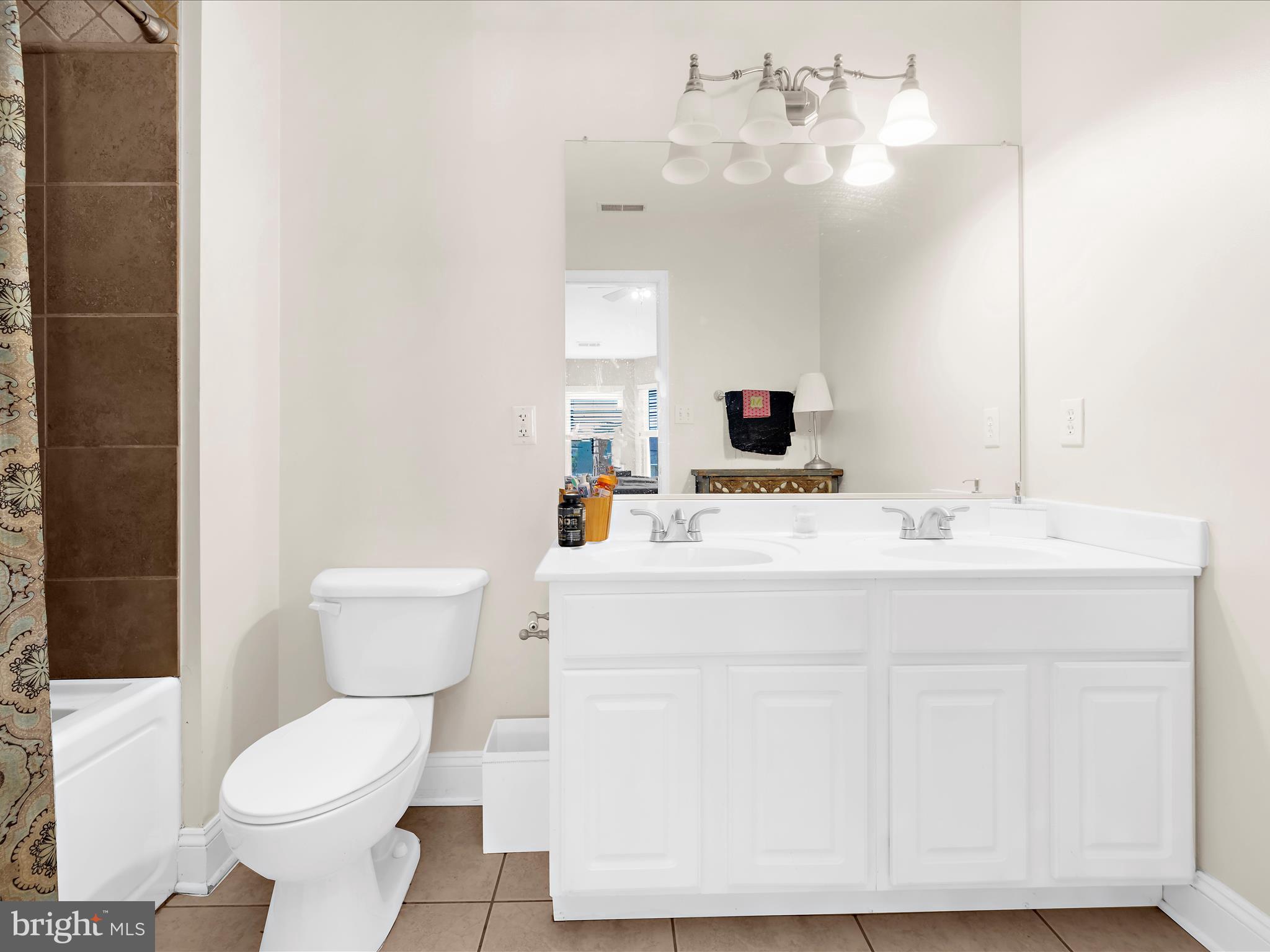 166 Meadow Road Pasadena, MD 21122 - Photo 20 of 47 a bathroom with a sink mirror and toilet