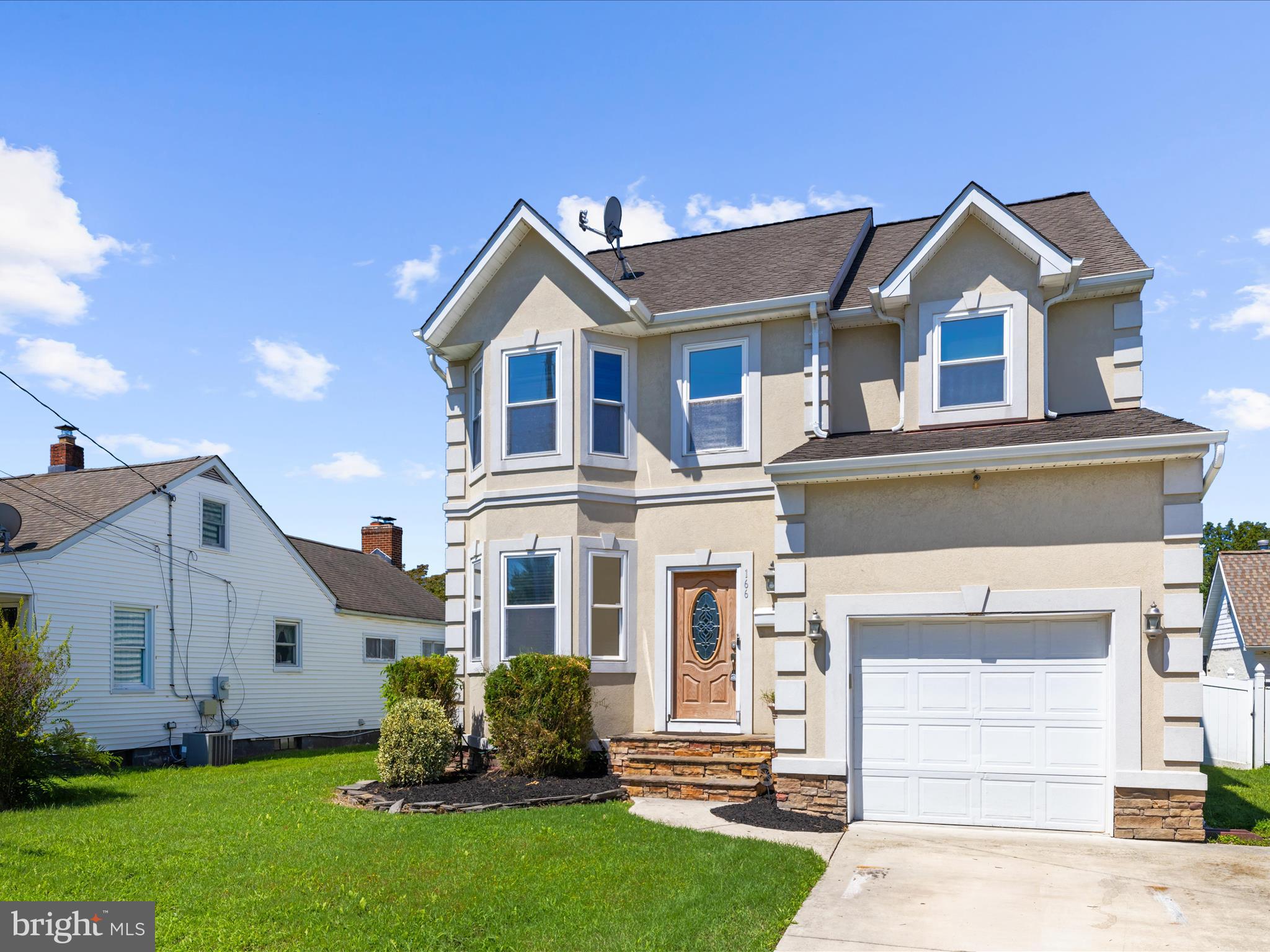 166 Meadow Road Pasadena, MD 21122 - Photo 2 of 47 a front view of a house with a yard