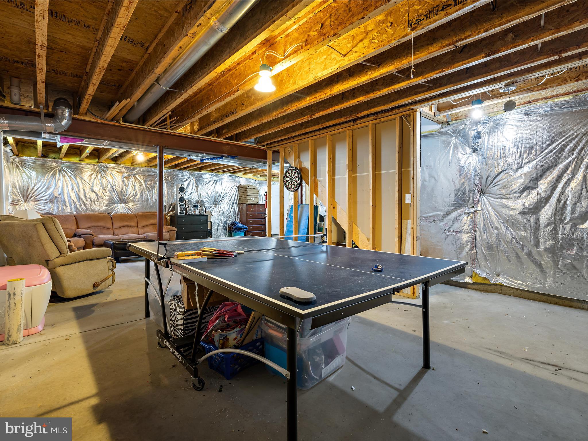 166 Meadow Road Pasadena, MD 21122 - Photo 32 of 47 a dining room with furniture and a floor to ceiling window