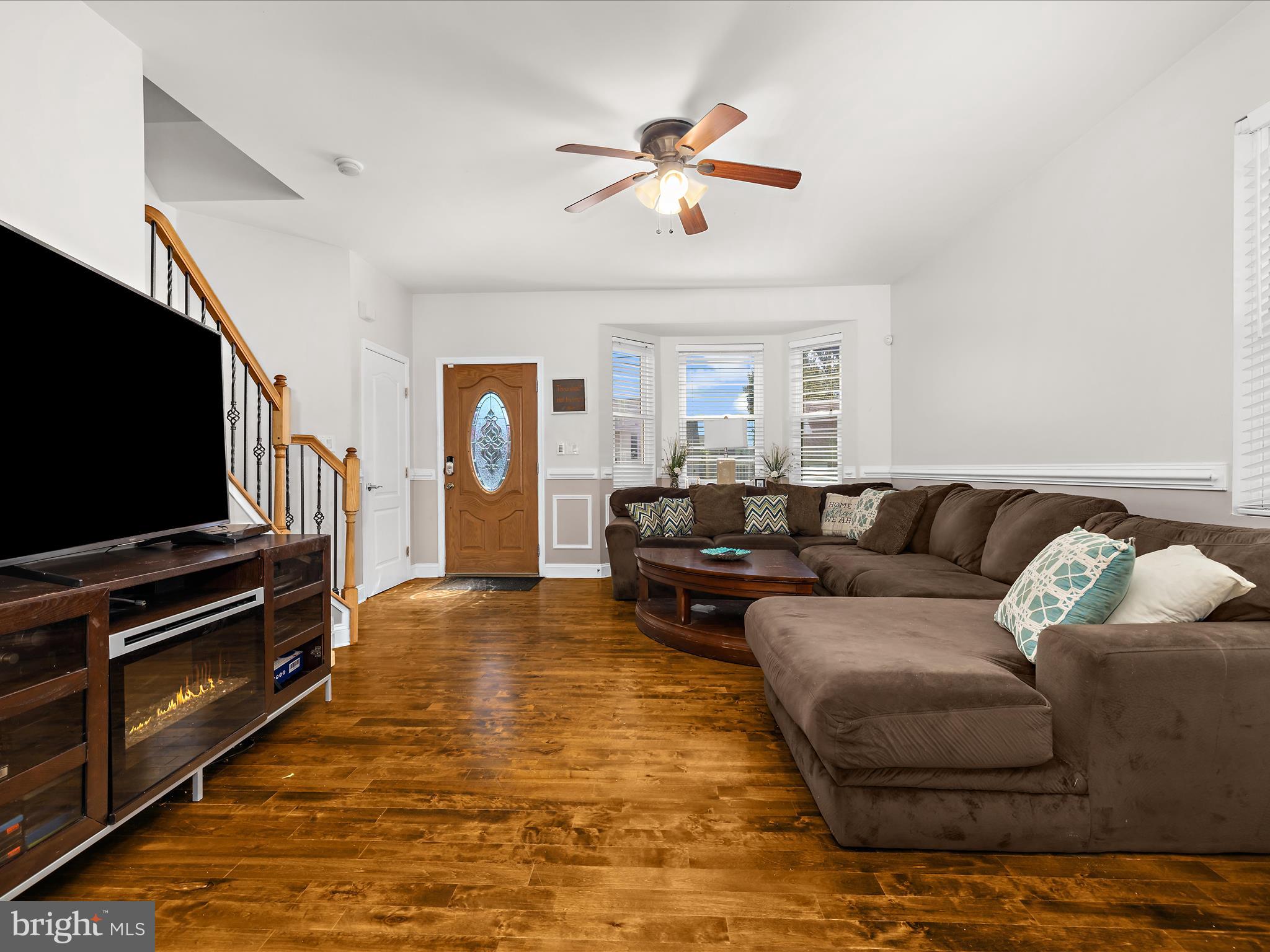 166 Meadow Road Pasadena, MD 21122 - Photo 6 of 47 a living room with furniture and a flat screen tv