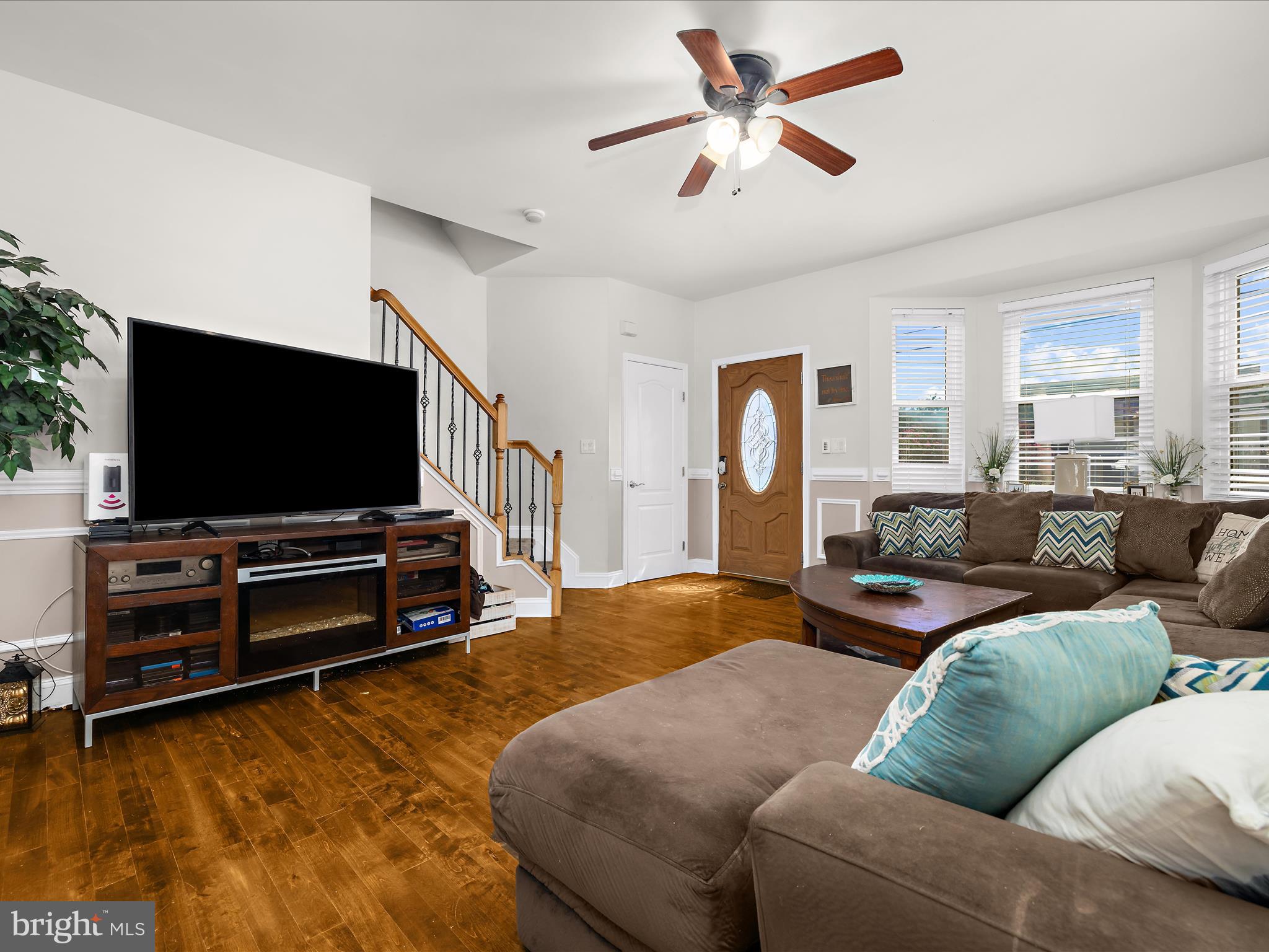 166 Meadow Road Pasadena, MD 21122 - Photo 7 of 47 a living room with furniture and a flat screen tv