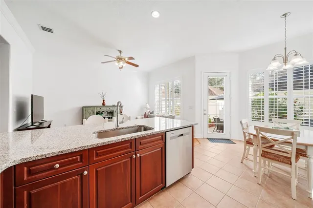 a spacious bathroom with a double vanity sink a mirror and a bathtub