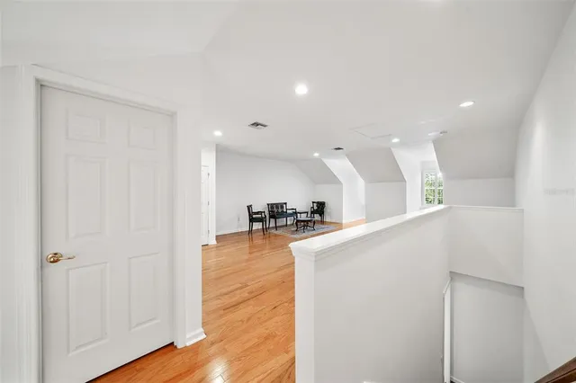 a view of a living room and a wooden floor