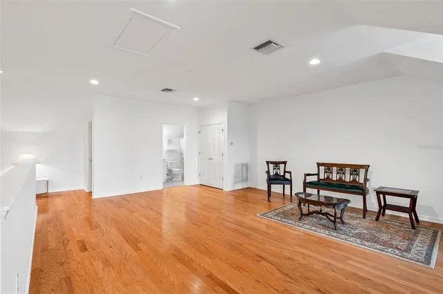 a bathroom with a sink toilet vanity and shower