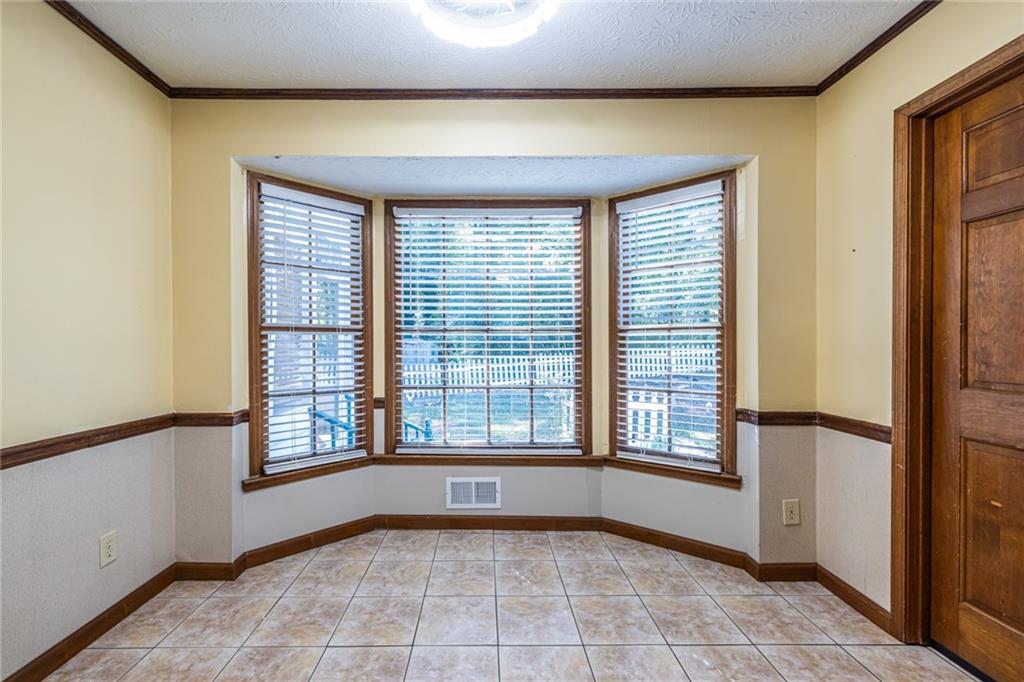 1465 Pounds Road Southwest Lilburn, GA 30047 - Photo 11 of 30 a view of an empty room with a window